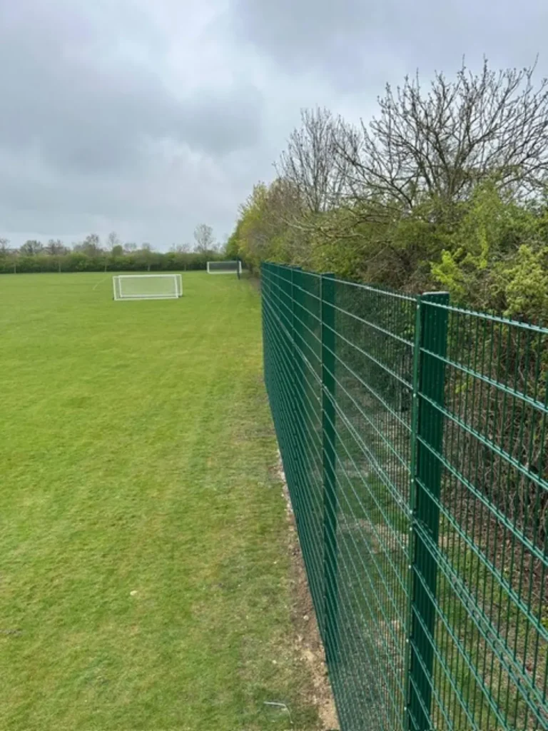 4 metre green twin wire ball stop fencing behind a goal at Pirton Sports and Social Club